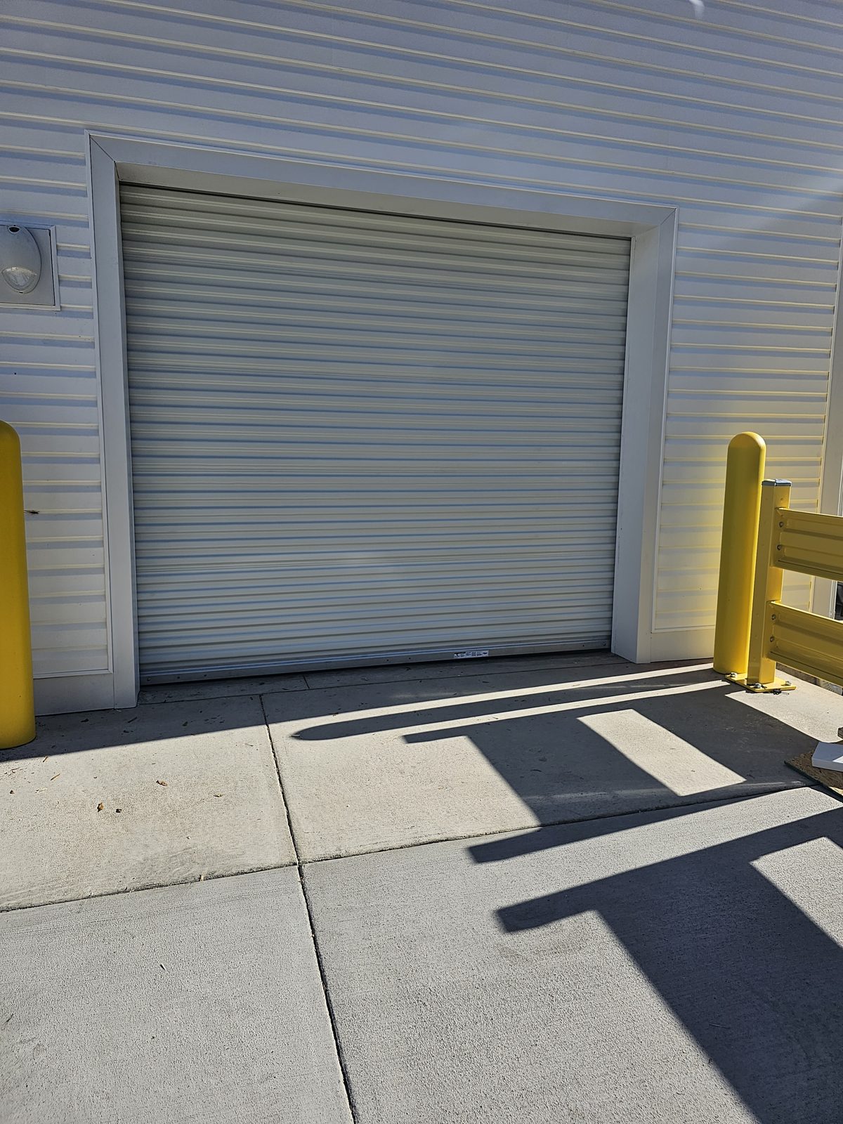 White sectional garage door installation by Premier Access Solutions